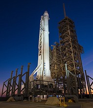 SpaceX's Falcon 9 rocket and Dragon spacecraft wait for liftoff at Launch Complex 39A at NASA's Kennedy Space Center in Florida.
