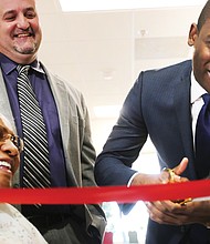 Richmond Mayor Levar M. Stoney cuts the ribbon celebrating the completion of the $5 million renovation of the William Byrd Senior Apartments, a former hotel at 2501 W. Broad St. that now provides 104 rental units for the elderly and disabled.