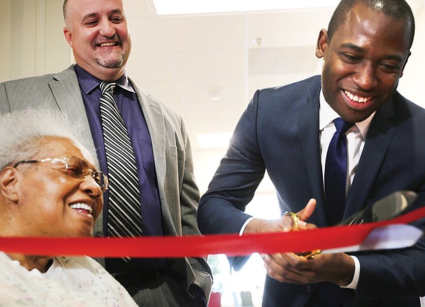 Richmond Mayor Levar M. Stoney cuts the ribbon celebrating the completion of the $5 million renovation of the William Byrd Senior Apartments, a former hotel at 2501 W. Broad St. that now provides 104 rental units for the elderly and disabled.