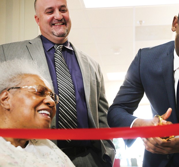 Richmond Mayor Levar M. Stoney cuts the ribbon celebrating the completion of the $5 million renovation of the William Byrd Senior Apartments, a former hotel at 2501 W. Broad St. that now provides 104 rental units for the elderly and disabled.
