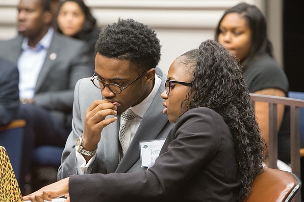 The Great Debaters // Jerry Ruffin and Riqia Taylor strategize before presenting their argument during “The Great Debate” sponsored by The Gloucester Institute Board of Directors and its president, Kay Coles James. Teams of college students who are part of the institute’s Emerging Leaders program debated the question of immigration over two days. 
