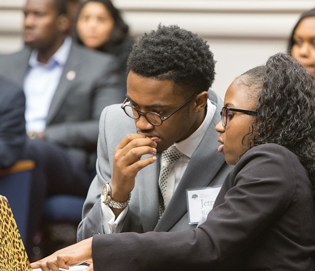 The Great Debaters // Jerry Ruffin and Riqia Taylor strategize before presenting their argument during “The Great Debate” sponsored by The Gloucester Institute Board of Directors and its president, Kay Coles James. Teams of college students who are part of the institute’s Emerging Leaders program debated the question of immigration over two days. 
