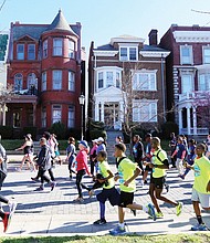 This photo captures just a few of the more than 26,000 people participating in last Saturday’s 18th Annual Monument Avenue 10K that also draws people ready to have fun while they exercise. 