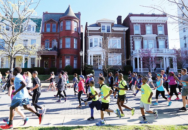 This photo captures just a few of the more than 26,000 people participating in last Saturday’s 18th Annual Monument Avenue 10K that also draws people ready to have fun while they exercise. 