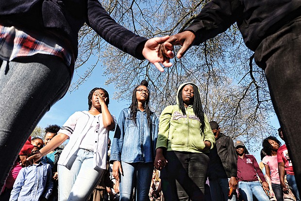 In memory and tears // About 200 people gather at a prayer vigil Sunday in Mosby Court for Mikkaisha D. Smoot, 16, and Taliek K. Brown, 15. The two were found fatally wounded shortly after 1 a.m. March 29 in front of an apartment building in the 1900 block of Accommodation Street in Mosby Court. A third person, an adult, is expected to recover from her non life-threatening gunshot wounds. 
An investigation continues into their deaths, which police have ruled as homicides. 
Mothers of the slain teens were joined at the vigil by family, friends and classmates of their children. The group joined hands, prayed and then released balloons in their memory following the vigil. 
