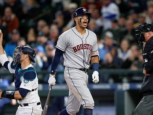 Houston Astros shortstop Carlos Correa (1) reacts after striking out with the bases loaded against the Seattle Mariners during the eighth inning at Safeco Field. Seattle defeated Houston 6-0. Mandatory Credit: Joe Nicholson-USA TODAY Sports