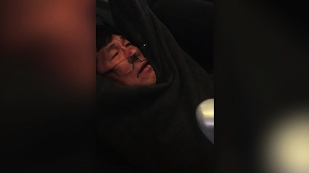 	Several passengers on United flight 3411 from Chicago O'Hare International Airport to Louisville, Kentucky, captured video as a man was dragged off the plane by authorities after he apparently refused to leave from an overbooked flight.