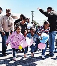 Ready, set, go hunt Easter eggs! // Dozens of children take off from the starting line last Saturday at the 5th Annual Easter Egg Hunt and Celebration at Blackwell Community Center sponsored by Putting Communities Together Inc. The event included a visit from the Easter Bunny, food and prizes. The Easter Bunny also made an appearance last Saturday at the Great Big Egg Hunt at Abner Clay Park
