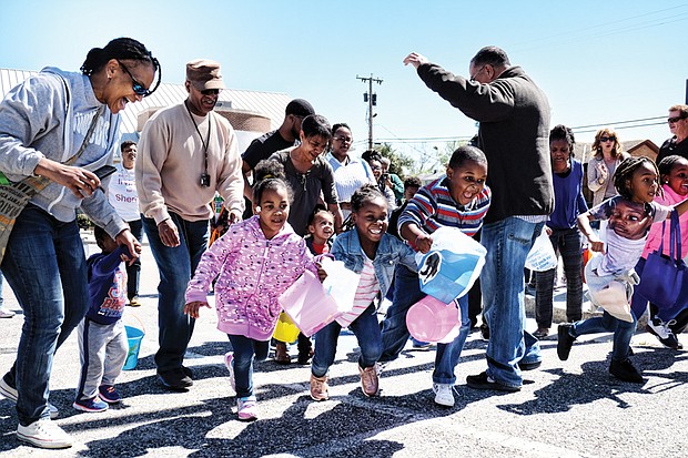 Ready, set, go hunt Easter eggs! // Dozens of children take off from the starting line last Saturday at the 5th Annual Easter Egg Hunt and Celebration at Blackwell Community Center sponsored by Putting Communities Together Inc. The event included a visit from the Easter Bunny, food and prizes. The Easter Bunny also made an appearance last Saturday at the Great Big Egg Hunt at Abner Clay Park
