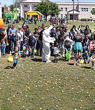 Ready, set, go hunt Easter eggs! // To cheer on youngsters in the 6-year-old and under category as they ran to fill their baskets from the colorful collection strewn across the grass. The Great Big Egg Hunt, sponsored in Jackson Ward by Center Church, also included an egg hunt for older children, games, bounce houses and food.