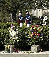 Members of the Virginia Tech Corps of Cadets stand at attention on the Virginia Tech campus in Blacksburg, Va,. on, April 16, 2017, during a 10th anniversary observance of a mass shooting that killed 32.  