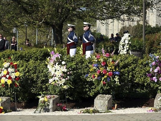 Members of the Virginia Tech Corps of Cadets stand at attention on the Virginia Tech campus in Blacksburg, Va,. on, April 16, 2017, during a 10th anniversary observance of a mass shooting that killed 32.  