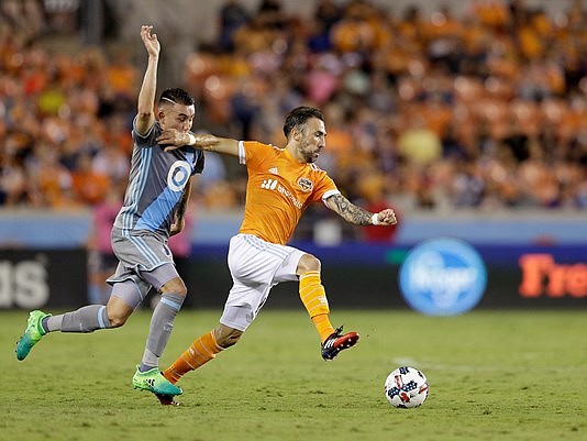 Apr 15, 2017; Houston, TX, USA; Houston Dynamo forward Vicente Sanchez (10) dribbles against Minnesota United midfielder Rasmus Schuller (20) in the second half at BBVA Compass Stadium. Dynamo tied the United 2 to 2. Thomas B. Shea-USA TODAY Sports
