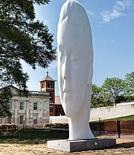 Call it the new face of the Virginia Museum of Fine Arts. The dramatic 24-foot head now dominates the sculpture garden at the public art museum on the Boulevard. Titled “Chloe,” the sculpture is the creation of Spanish artist Jaume Plensa, who will be at the museum Thursday, April 27, for the dedication. The museum commissioned the contemplative work that is made of polyester resin and marble dust placed over a stainless-steel frame. “Chloe” is one of a series of heads that Mr. Plensa has created for museums in the United States and overseas, and defines the VMFA’s ambitions to commission national and international artists to provide new works for the nearly 4-acre E. Claiborne and Lora Robins Sculpture Garden. 