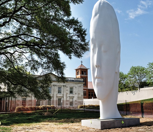 Call it the new face of the Virginia Museum of Fine Arts. The dramatic 24-foot head now dominates the sculpture garden at the public art museum on the Boulevard. Titled “Chloe,” the sculpture is the creation of Spanish artist Jaume Plensa, who will be at the museum Thursday, April 27, for the dedication. The museum commissioned the contemplative work that is made of polyester resin and marble dust placed over a stainless-steel frame. “Chloe” is one of a series of heads that Mr. Plensa has created for museums in the United States and overseas, and defines the VMFA’s ambitions to commission national and international artists to provide new works for the nearly 4-acre E. Claiborne and Lora Robins Sculpture Garden. 