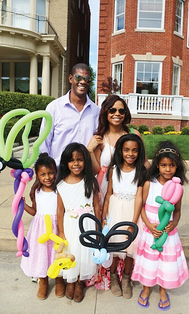 See and be seen  at Easter on Parade // Tillman and Cassie Breckenridge of Midlothian enjoy the day with their four daughters, from left, Paige, 4, Brynn, 5, Reese, 8, and Avery, 5. 
