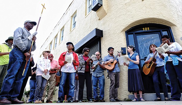 Stations of the Cross // At each of the 14 stops along the route, the group of nearly two dozen people stopped to sing and pray for victims of violence and abuse in the Richmond area, all those involved with the criminal justice system and for state, local and regional government officials.  
