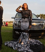 	Milan Bolden-Morris wore a dress featuring pictures of Trayvon Martin, Sandra Bland, Michael Brown, and others to her high school prom.
/Credit:	Terrence Torrence