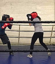 Amaiya Zafar (left), 16, started boxing three years ago and is already making waves in the boxing community. Not only is the Minnesota teen competing in a male-dominated sport, but she's also a devout Muslim.