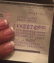 	Sergio Juarez returns money order to Yesenia Del Valle.
