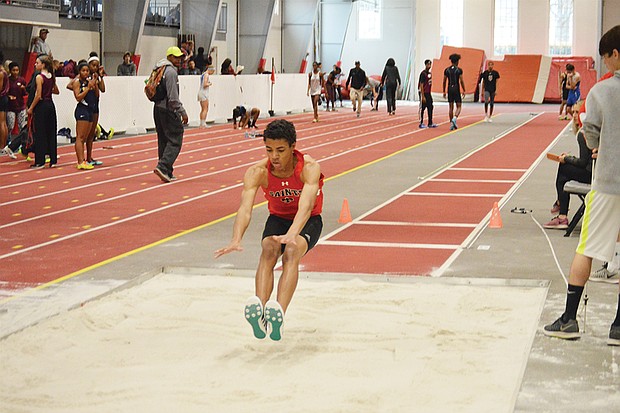 St. Christopher’s sophomore Frank Royal III lands during the long jump competition at a recent meet on the school’s indoor track.