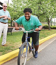 Getting his wheels //

Anthony Bullock, 12, works on his balance and gets comfortable riding a bicycle during a practice session last week at Great Shiplock Park. The student at Anna Julia Cooper Episcopal School in the East End was with Jim Cramer, a retired pilot who has been Anthony’s mentor for three years. The pair met when Anthony was a student at Richmond’s Woodville Elementary School through the public school’s relationship with the Micah Ministry of St. Paul’s Episcopal Church. 