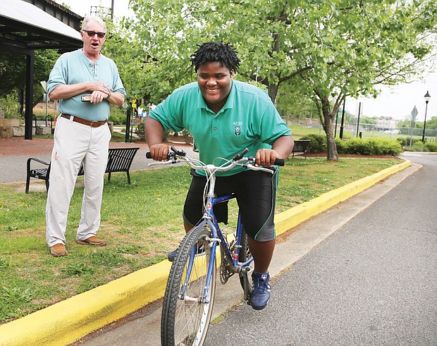 Getting his wheels //

Anthony Bullock, 12, works on his balance and gets comfortable riding a bicycle during a practice session last week at Great Shiplock Park. The student at Anna Julia Cooper Episcopal School in the East End was with Jim Cramer, a retired pilot who has been Anthony’s mentor for three years. The pair met when Anthony was a student at Richmond’s Woodville Elementary School through the public school’s relationship with the Micah Ministry of St. Paul’s Episcopal Church. 