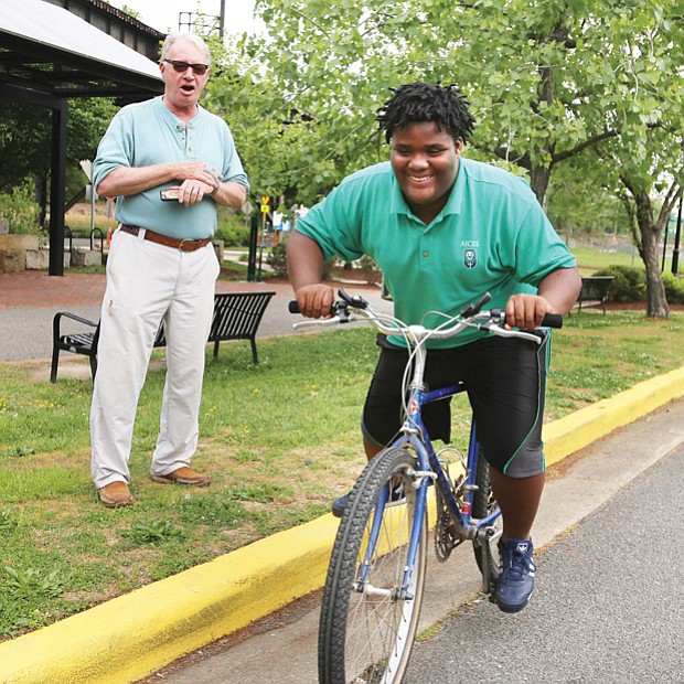 Getting his wheels //

Anthony Bullock, 12, works on his balance and gets comfortable riding a bicycle during a practice session last week at Great Shiplock Park. The student at Anna Julia Cooper Episcopal School in the East End was with Jim Cramer, a retired pilot who has been Anthony’s mentor for three years. The pair met when Anthony was a student at Richmond’s Woodville Elementary School through the public school’s relationship with the Micah Ministry of St. Paul’s Episcopal Church. 