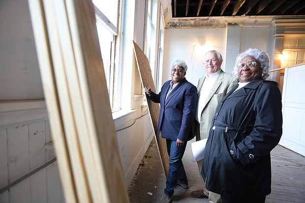 From left, partners Wanda Stallings, Charles E. Ayers Jr. and Margaret Stallings pose on the fourth floor of the St. Luke building, which once held the offices of the Independent Order of St. Luke, an African-American insurance and mutual society, and the St. Luke Penny Savings Bank that Maggie Walker founded in 1903 during her tenure as leader of the organization.   