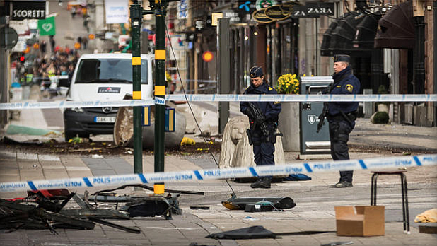 Police attend the scene of the terrorist attack where a truck crashed after driving down a pedestrian street in downtown Stockholm on April 8, 2017 in Stockholm, Sweden. 