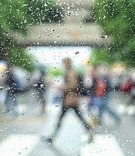 Raindrops transform pedestrians into artful abstract figures from a modern painting. The photographer captured the image of Virginia Commonwealth University students crossing Main Street at Laurel Street on Tuesday. It was the fourth straight day of rain and chilly temperatures. Ahead, the fickle weather is about to turn warm, with the temperature forecast to soar into the 90s on Saturday before retreating into the mid-80s on Sunday. More rain and thunderstorms are forecast for Monday as temperatures return to the 70s. 