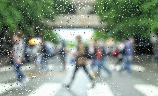 Raindrops transform pedestrians into artful abstract figures from a modern painting. The photographer captured the image of Virginia Commonwealth University students crossing Main Street at Laurel Street on Tuesday. It was the fourth straight day of rain and chilly temperatures. Ahead, the fickle weather is about to turn warm, with the temperature forecast to soar into the 90s on Saturday before retreating into the mid-80s on Sunday. More rain and thunderstorms are forecast for Monday as temperatures return to the 70s. 