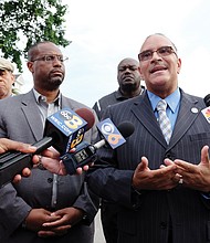 Richmond Police Chief Alfred Durham, right, and Richmond Schools Superintendent Dana T. Bedden talk with reporters after Monday’s shooting inside the school system’s Norrell Annex building at 201 W. Graham Road on North Side. 