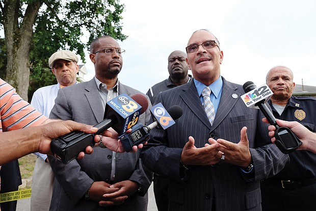 Richmond Police Chief Alfred Durham, right, and Richmond Schools Superintendent Dana T. Bedden talk with reporters after Monday’s shooting inside the school system’s Norrell Annex building at 201 W. Graham Road on North Side. 