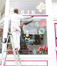 Senon Davis brightens the front of Saadia’s Juice Box and Yoga Bar, one of the newest businesses in Jackson Ward. Mr. Davis spent a recent Sunday adding fresh, attention-grabbing color to the business at 402½ N. 2nd St. Opened in January, owner Saadia Yasmin combines yoga and belly dancing classes with a mix of Persian-style baked goods, salads and beverages — ranging from coffee, espresso and tea to raw juices and special concoctions of fruit, vegetables and spice smoothies.