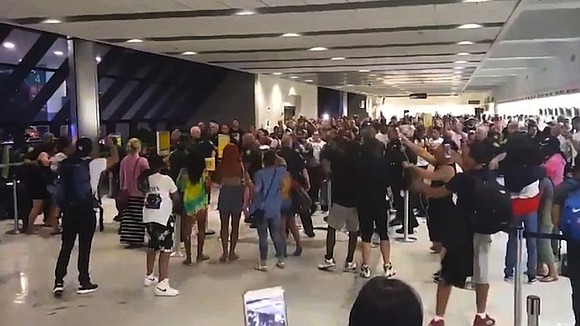 Screams and commotion took over Fort Lauderdale's airport Monday as travelers clashed with Spirit Airlines employees and police.