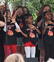 Strawberry Street Festival //
Youngsters from Richmond’s William Fox Elementary School perform during the 38th Annual Strawberry Street Festival last Saturday. The event featured games, rides, raffles, auctions and, of course, strawberries. Proceeds from the festival benefit the school.