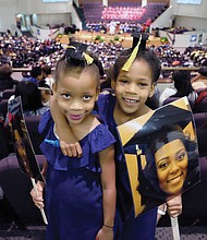 Future grads // Twins Cydney and Camryn Hamlin, 6, of Philadelphia are ready and waiting to see big sister Tyler Stafford get her degree at Virginia Union University’s commencement last Saturday at St. Paul’s Baptist Church. The duo led Ms. Stafford’s cheering section. Please see area commencement coverage and photos, B2 and B3.
