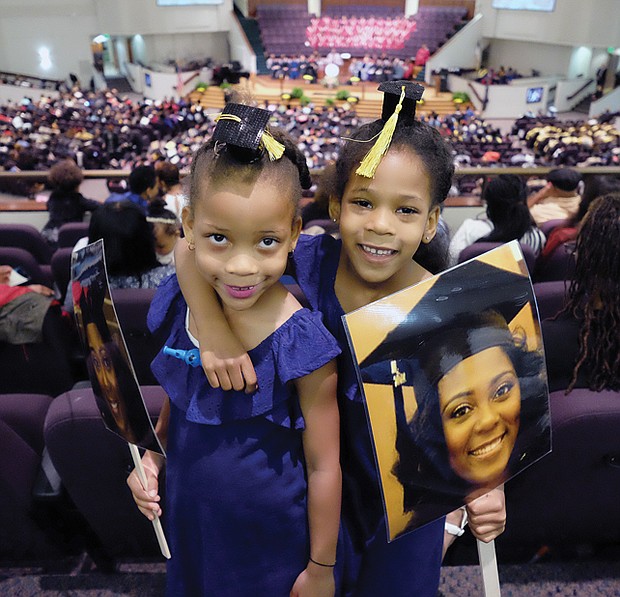 Future grads // Twins Cydney and Camryn Hamlin, 6, of Philadelphia are ready and waiting to see big sister Tyler Stafford get her degree at Virginia Union University’s commencement last Saturday at St. Paul’s Baptist Church. The duo led Ms. Stafford’s cheering section. Please see area commencement coverage and photos, B2 and B3.
