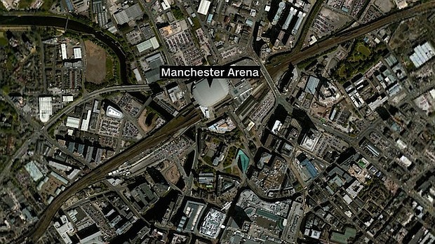 Police in Manchester, England, warned people to stay away from Manchester Arena after reports of two loud explosions during an Ariana Grande concert Monday night on May 22, 2017. People are seen here moving out of the arena.