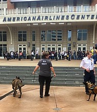 Authorities say that they are increasing the number of officers at arenas in wake of the Manchester Arena attack on May 22, 2017. Officers are seen here outside a New Kids On The Block concert in Dallas on Tuesday, May 23, 2017 with bomb-sniffing dogs.