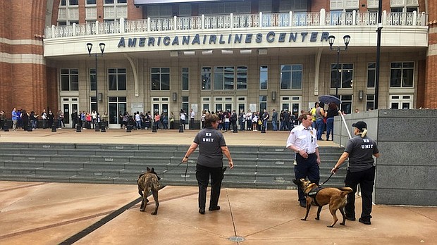 Authorities say that they are increasing the number of officers at arenas in wake of the Manchester Arena attack on May 22, 2017. Officers are seen here outside a New Kids On The Block concert in Dallas on Tuesday, May 23, 2017 with bomb-sniffing dogs.