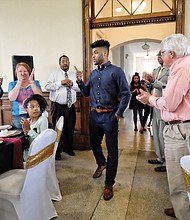 Frank Mason III enters Petersburg’s Union Station to the ovation of about 100 fans, friends and family members last Friday during the Frank Mason III Day celebration.