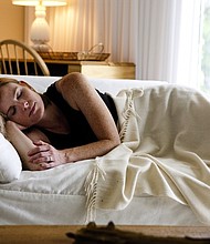 	A stock image of a person sleeping on the couch. /Credit:	Amanda Green/Turner
	