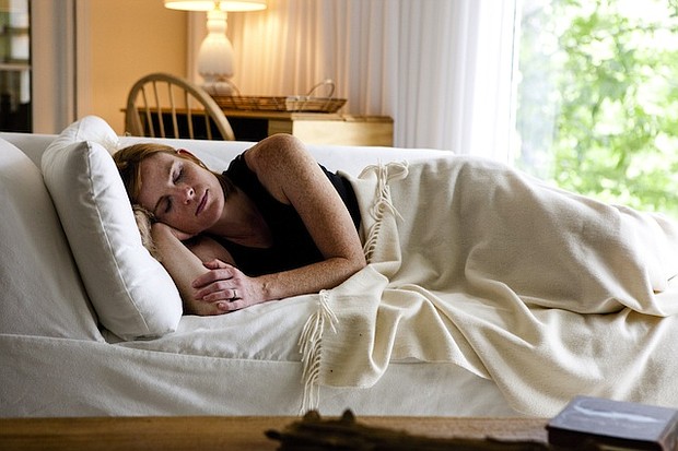 	A stock image of a person sleeping on the couch. /Credit:	Amanda Green/Turner
	