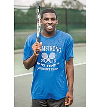 Charlesten Freeman, 16, proudly wears a Armstrong High School championship shirt during a recent practice. The Franklin Military Academy sophomore plays on the Armstrong tennis team.
