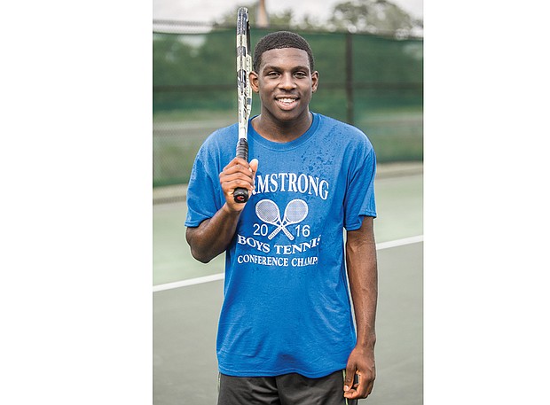 Charlesten Freeman, 16, proudly wears a Armstrong High School championship shirt during a recent practice. The Franklin Military Academy sophomore plays on the Armstrong tennis team.
