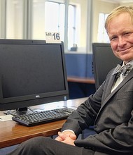 Scott Firestine, director of the Richmond Public Library, sits in one of the smaller computer labs available to the public in the library’s Main Branch at 101 E. Franklin St. in Downtown. Patrons can use the computer lab to access the library’s expanded array of digital materials.