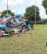 Former Special Officer Brad Hughes, who lost his legs in the line of duty in 2014, visits the memorial to Virginia State Police Special Agent Michael T. Walter that sits outside of the State Police Headquarters on Midlothian Turnpike in Chesterfield County. Mr. Hughes said Tuesday that he knew Agent Walter and wanted to pay his respects.