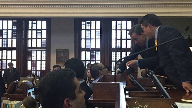 Texas House Speaker Joe Straus congratulates Chairman Coleman on passage of the Sandra Bland Act on May 19, 2017.